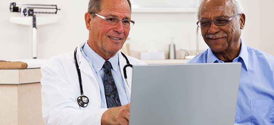 Two men talking at healthcare appointment.