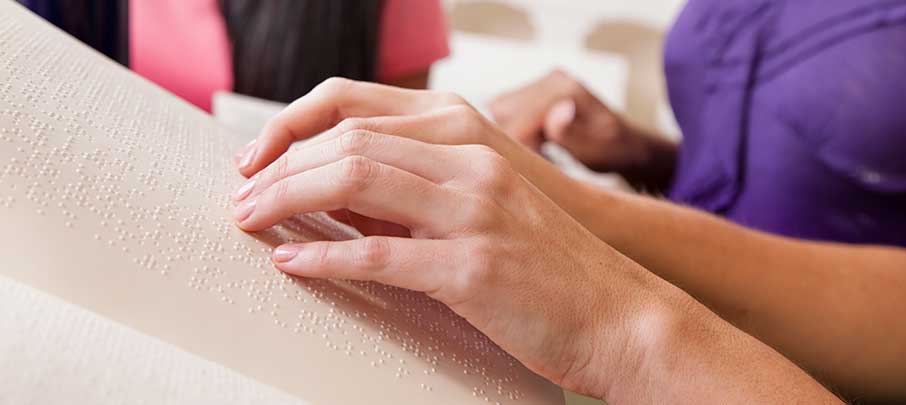 person reading braille