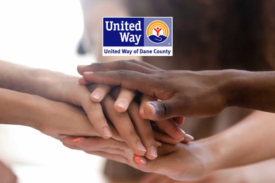 hands from different people come together one over another