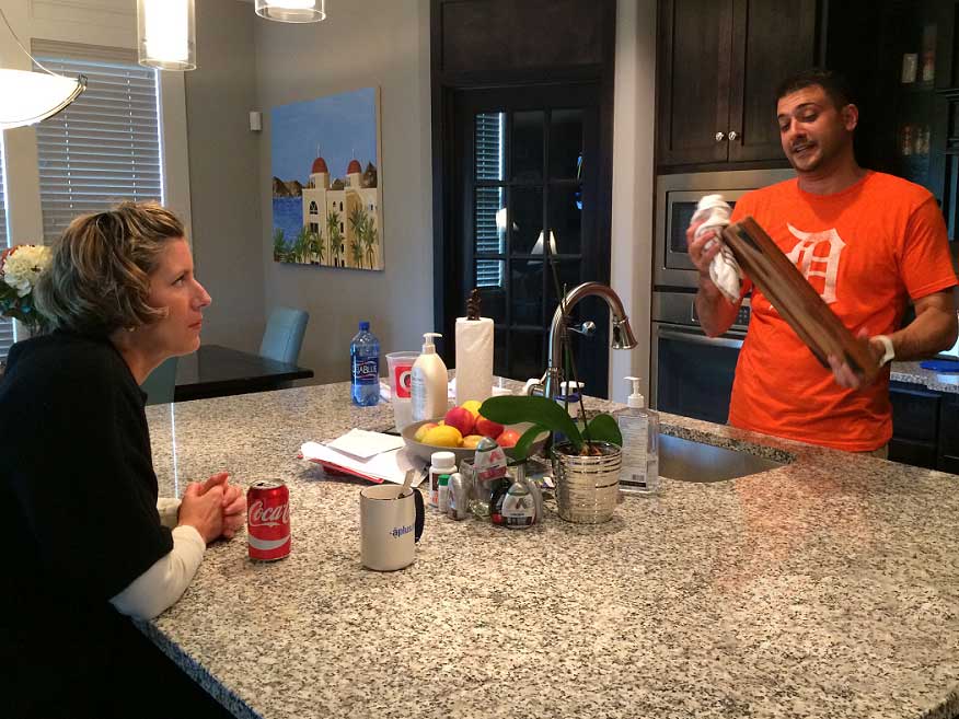 Man and woman talking in the kitchen