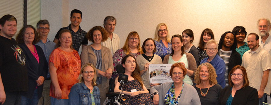 Employees from ERI holding a sign endorsing National disability Employment Awareness Month and this year's theme of Inclusion Drives Innovation.
